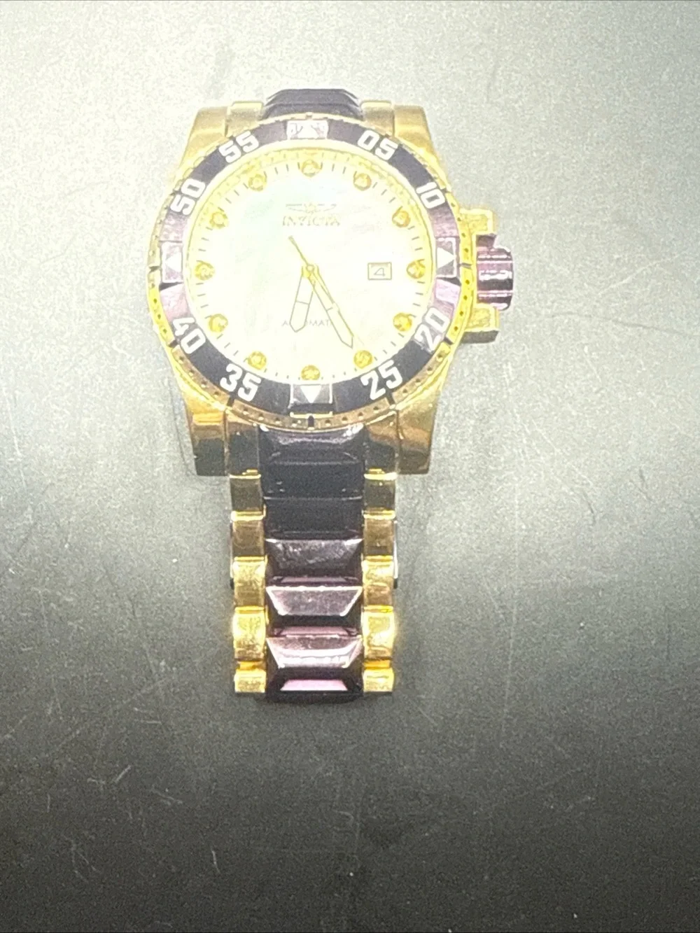 Invicta Excursion model 33349 MOP Dial Purple Gold Tone